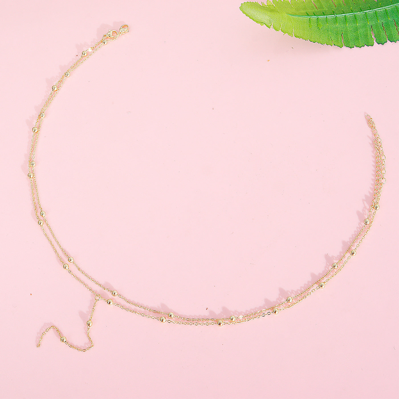 Collier simple à pompons multicouches en perles de riz