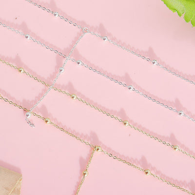 Collier simple à pompons multicouches en perles de riz